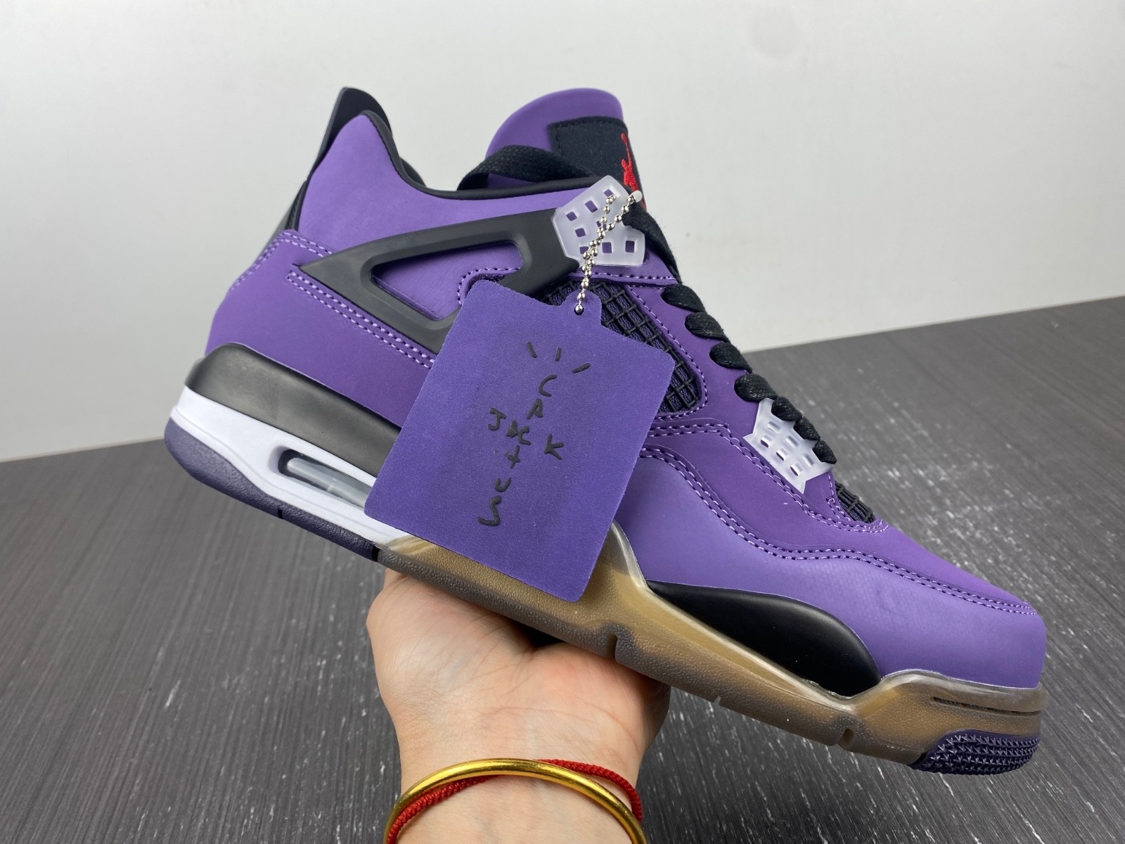 TRAVIS SCOTT X AIR JORDAN 4 IN PURPLE
