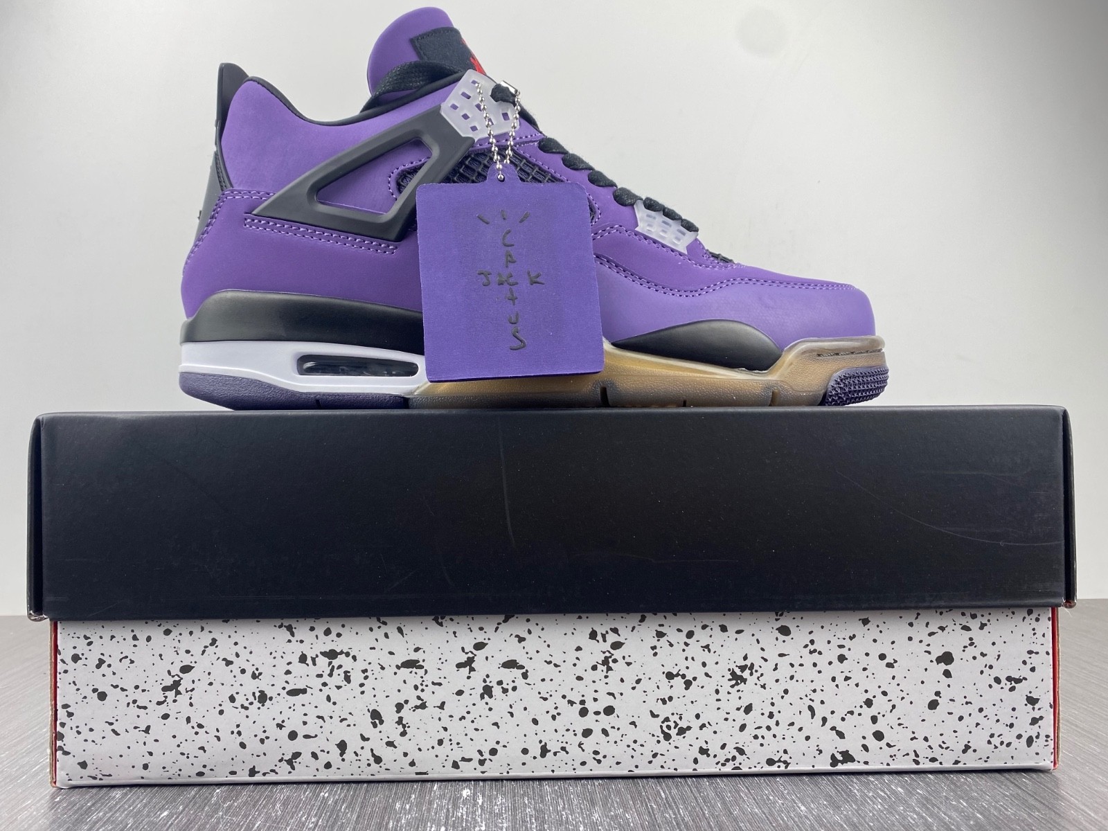 TRAVIS SCOTT X AIR JORDAN 4 IN PURPLE